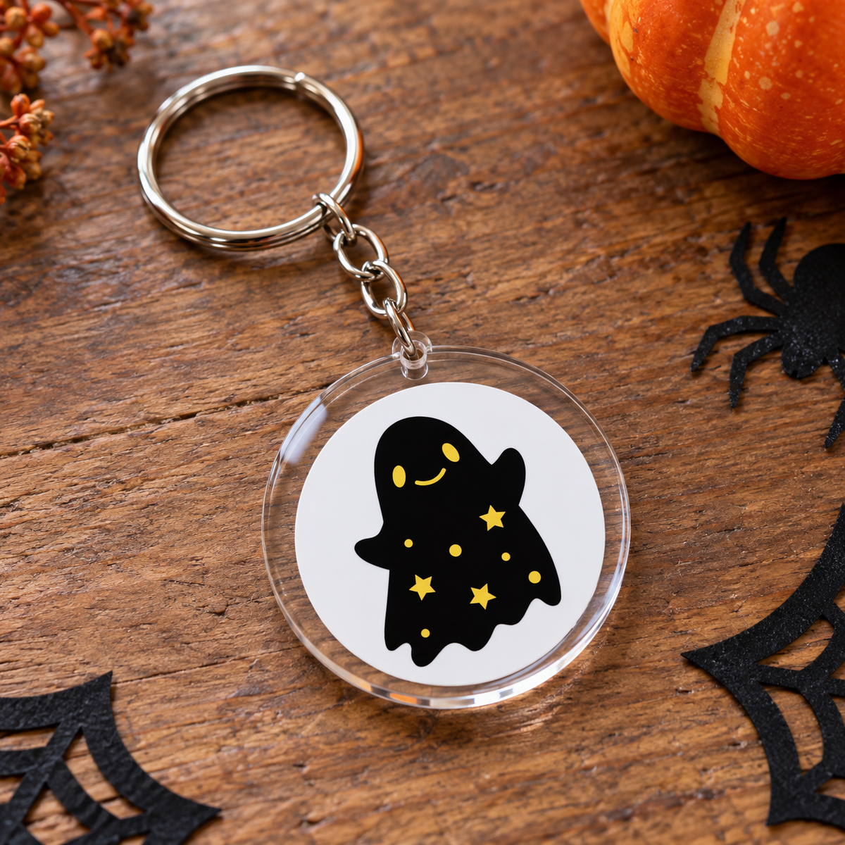 Porte-clés Halloween rond en acrylique petit fantôme noir aux étoiles dorées