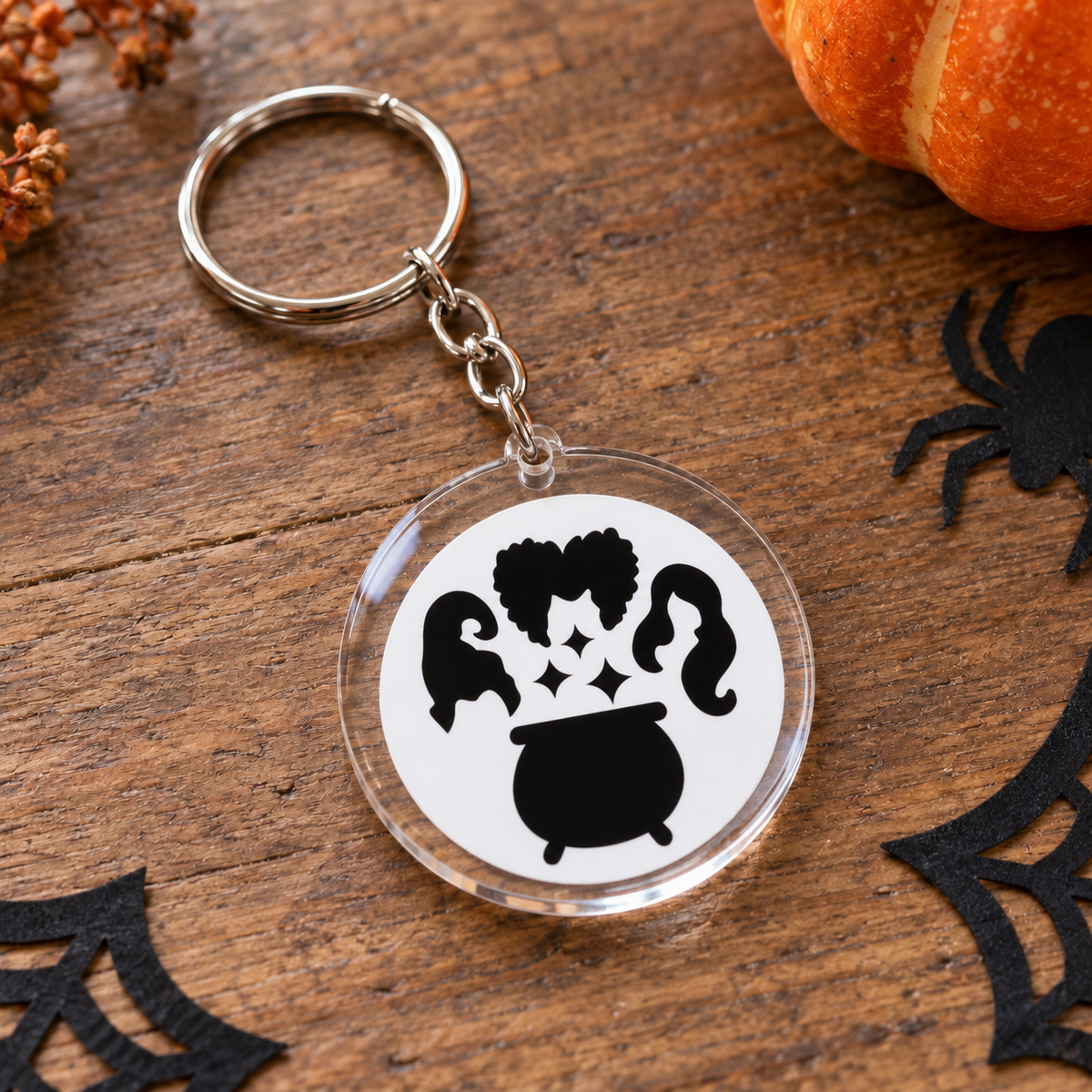 Porte-clés Halloween rond en acrylique silhouettes de sorcières et chaudron